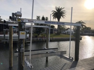 An aluminum boat lift cradle with direct drive assembly and aluminum bunks