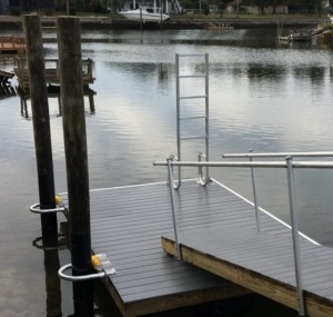 A floating dock ladder that swings down into the water