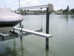 An aluminum walkboard installed on a boat lift as an accessory